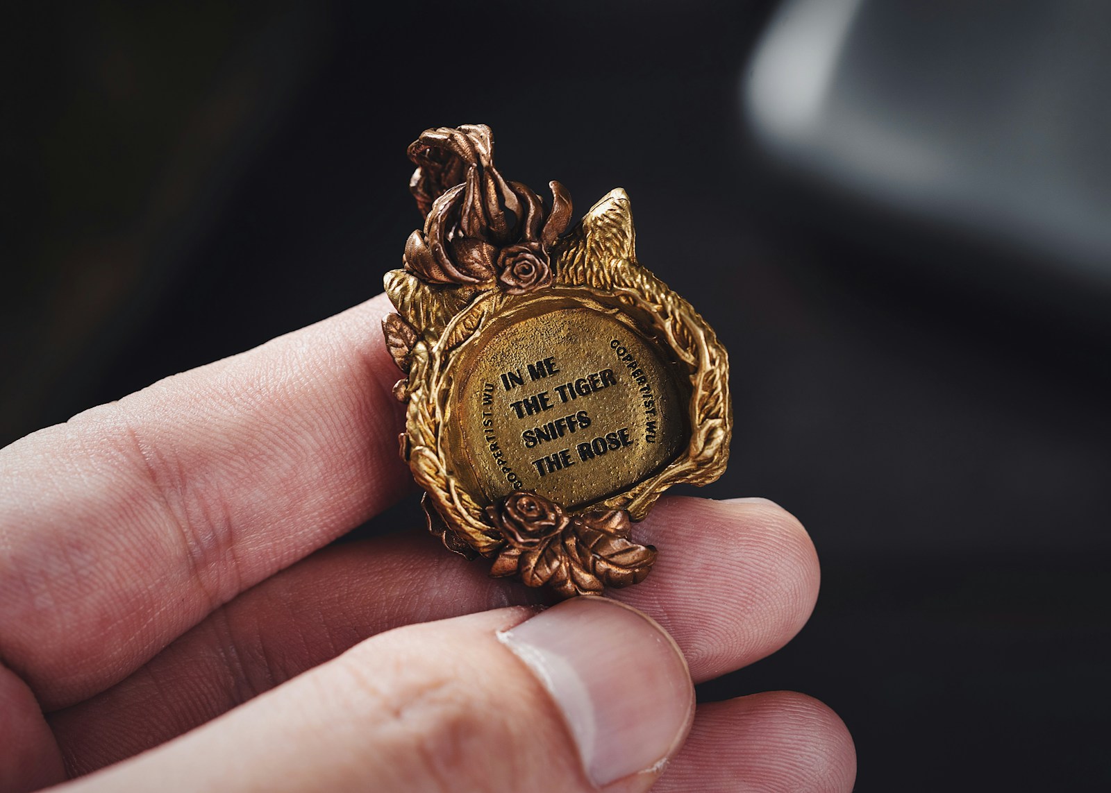 a person is holding a miniature picture in their hand